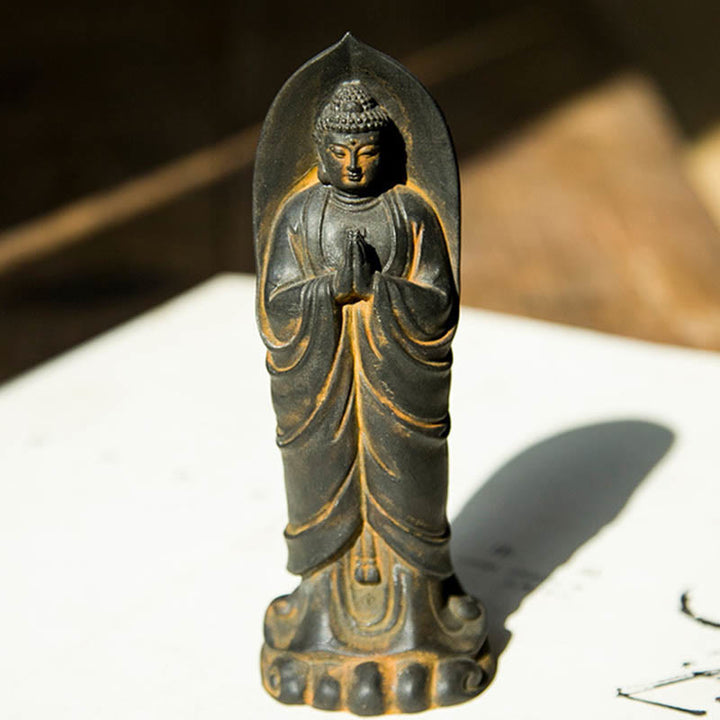 Decorazione della statua in resina colata di polvere di ferro Sakyamuni Buddha Namaste fatta a mano Buddha Stones