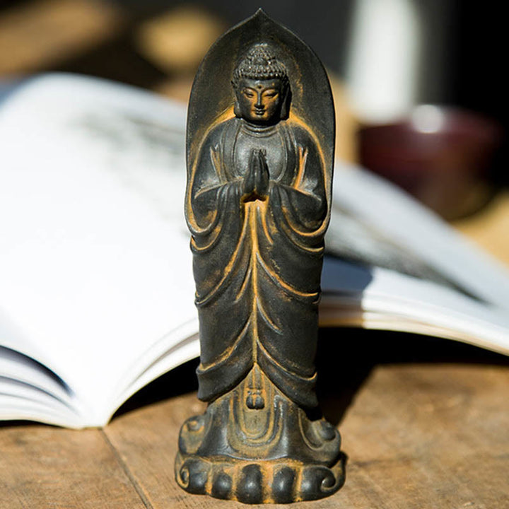 Decorazione della statua in resina colata di polvere di ferro Sakyamuni Buddha Namaste fatta a mano Buddha Stones