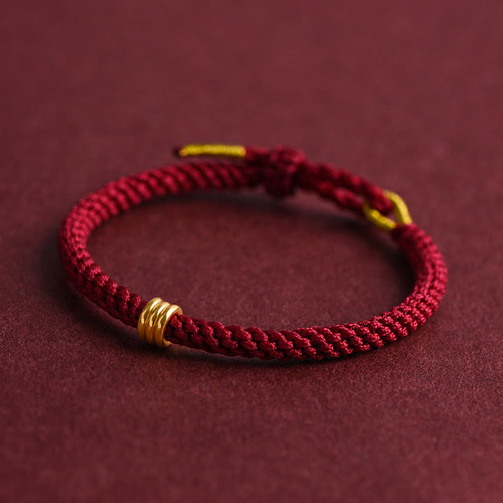 Braccialetto in corda intrecciata con design a triplo anello in oro 999 Buddha Stones