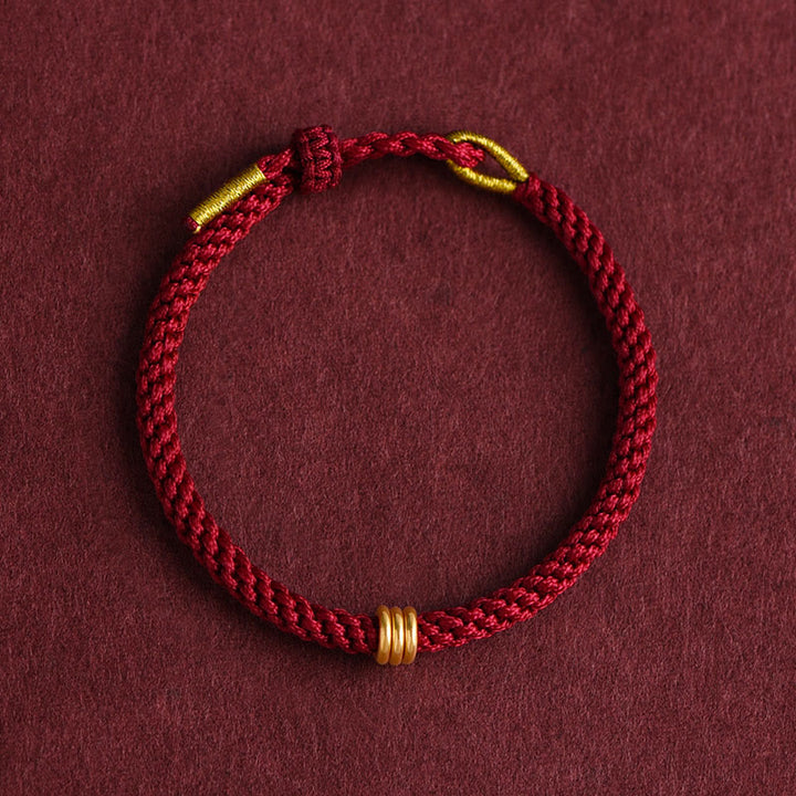 Braccialetto in corda intrecciata con design a triplo anello in oro 999 Buddha Stones - image 1