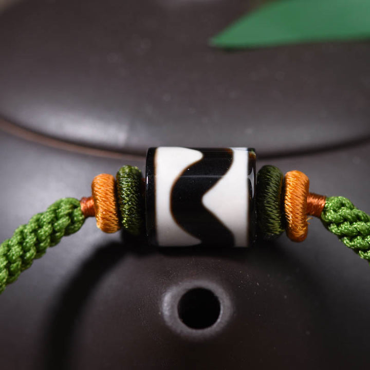 Braccialetto di corda verde intrecciata con perline tibetane Dzi fatte a mano di Buddha Stones