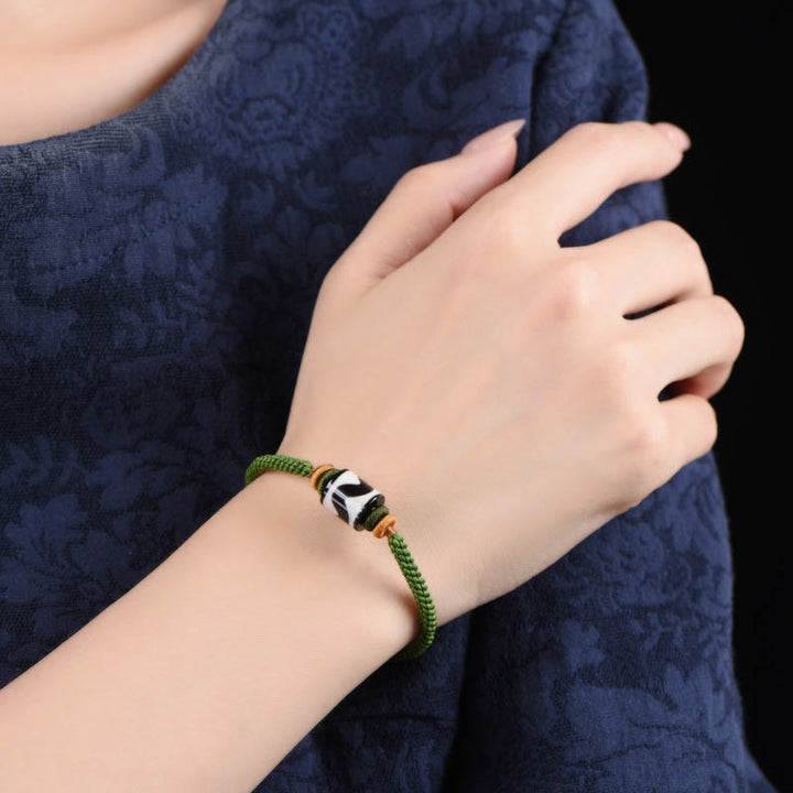 Braccialetto di corda verde intrecciata con perline tibetane Dzi fatte a mano di Buddha Stones