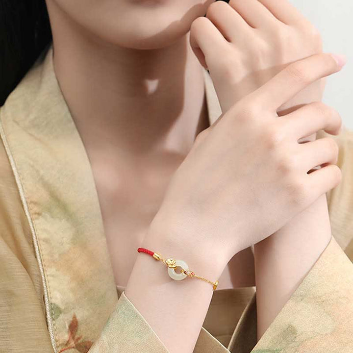Braccialetto in corda rossa Buddha Stones fibbia della pace in argento sterling 925 fatto a mano in giada Hetian cinese con pesce rosso
