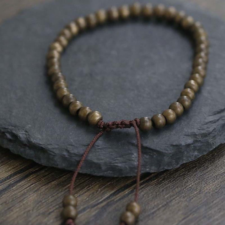 Bracciale semplice in ottone e rame con Buddha Stones, equilibrio e ricchezza