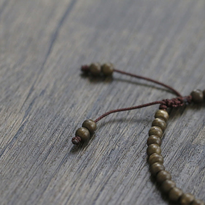 Bracciale semplice in ottone e rame con Buddha Stones, equilibrio e ricchezza