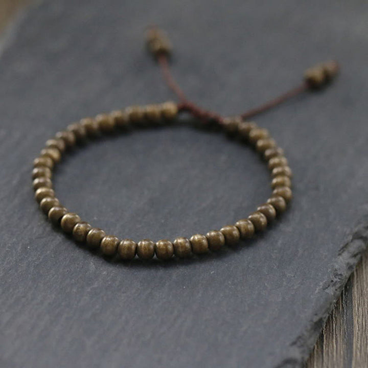 Bracciale semplice in ottone e rame con Buddha Stones, equilibrio e ricchezza