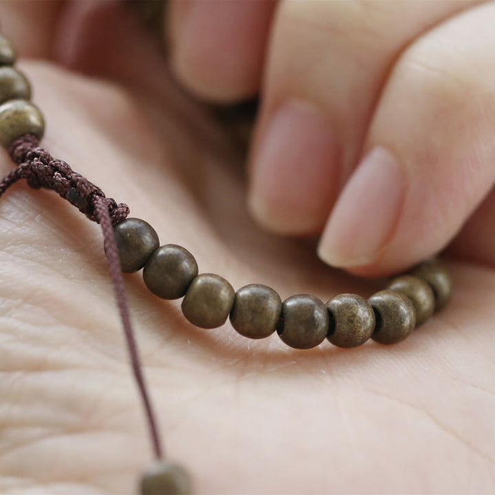 Bracciale semplice in ottone e rame con Buddha Stones, equilibrio e ricchezza
