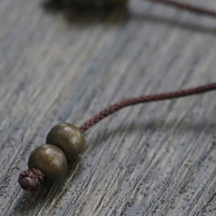 Bracciale semplice in ottone e rame con Buddha Stones, equilibrio e ricchezza
