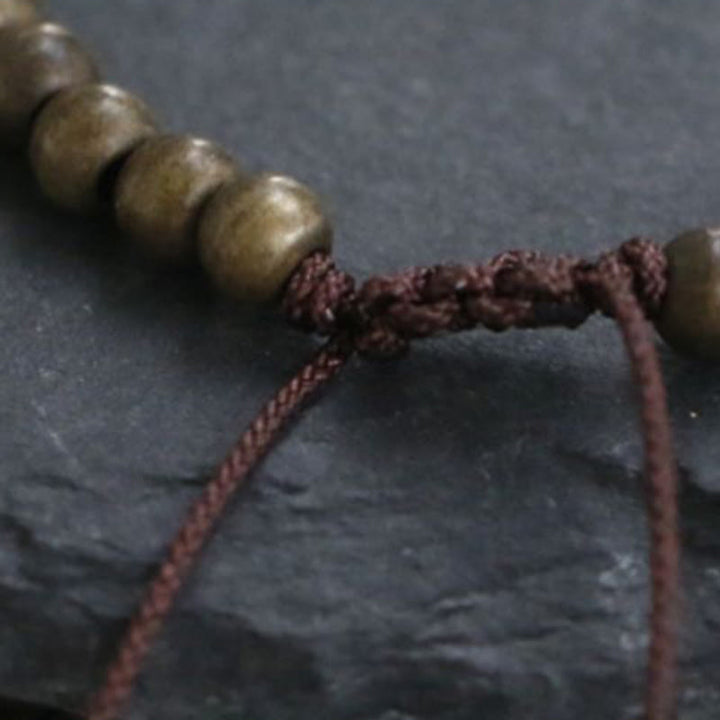Bracciale semplice in ottone e rame con Buddha Stones, equilibrio e ricchezza