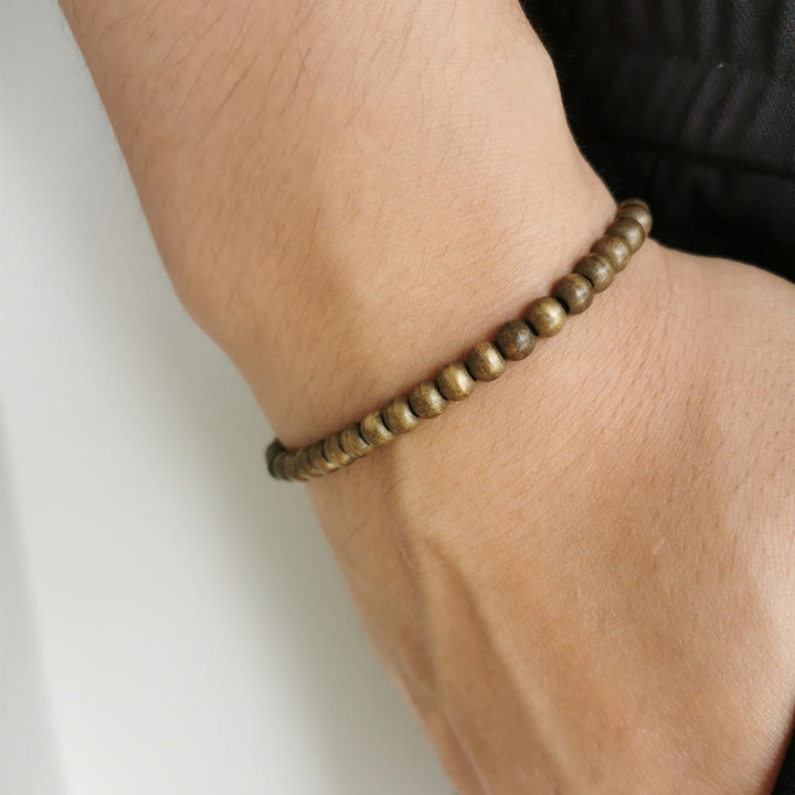 Bracciale semplice in ottone e rame con Buddha Stones, equilibrio e ricchezza