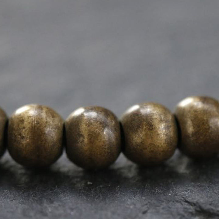 Bracciale semplice in ottone e rame con Buddha Stones, equilibrio e ricchezza