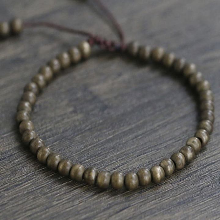 Bracciale semplice in ottone e rame con Buddha Stones, equilibrio e ricchezza