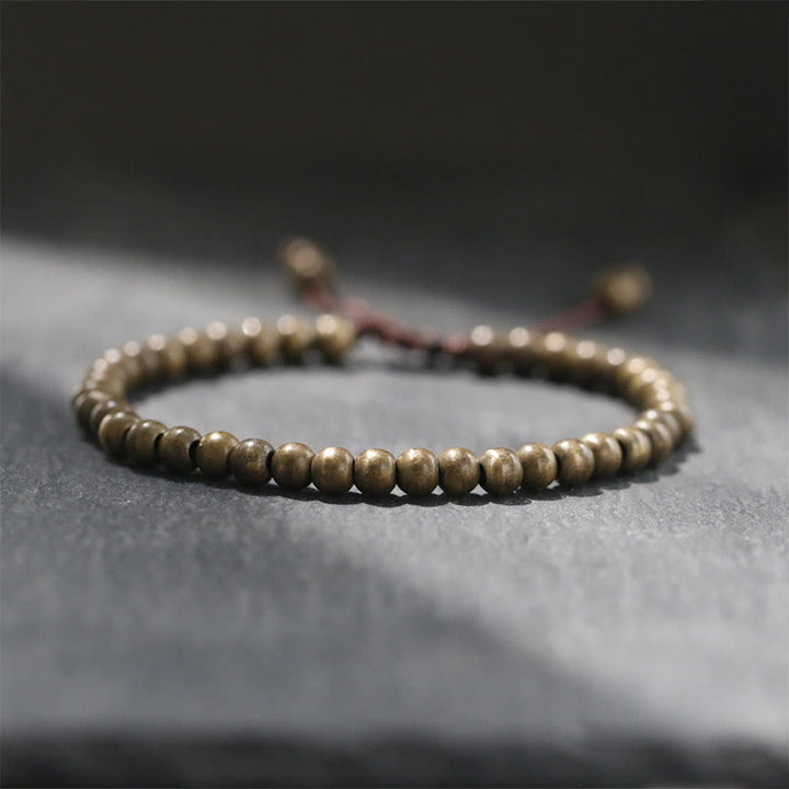 Bracciale semplice in ottone e rame con Buddha Stones, equilibrio e ricchezza