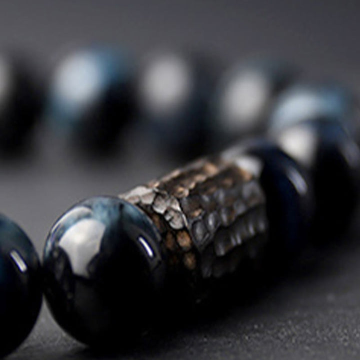 Braccialetto di perline di legno di ebano con occhio di tigre e Buddha Stones