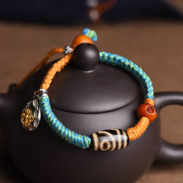 Bracciale intrecciato con perline Dzi tibetane fatte a mano di Buddha Stones