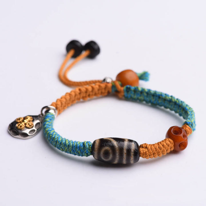 Bracciale intrecciato con perline Dzi tibetane fatte a mano di Buddha Stones