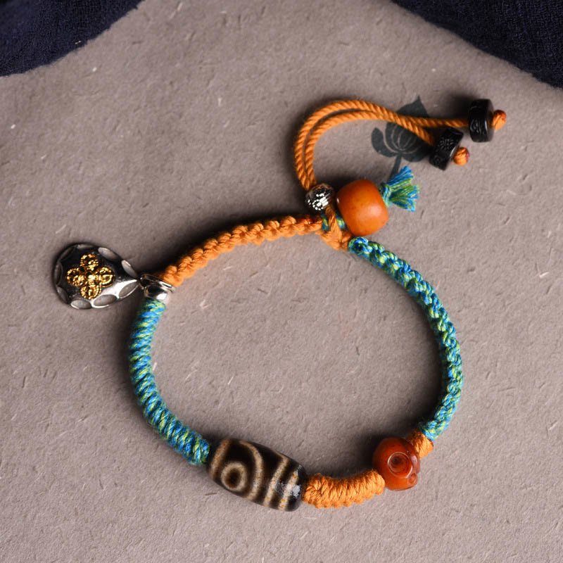 Bracciale intrecciato con perline Dzi tibetane fatte a mano di Buddha Stones