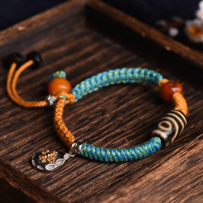 Bracciale intrecciato con perline Dzi tibetane fatte a mano di Buddha Stones