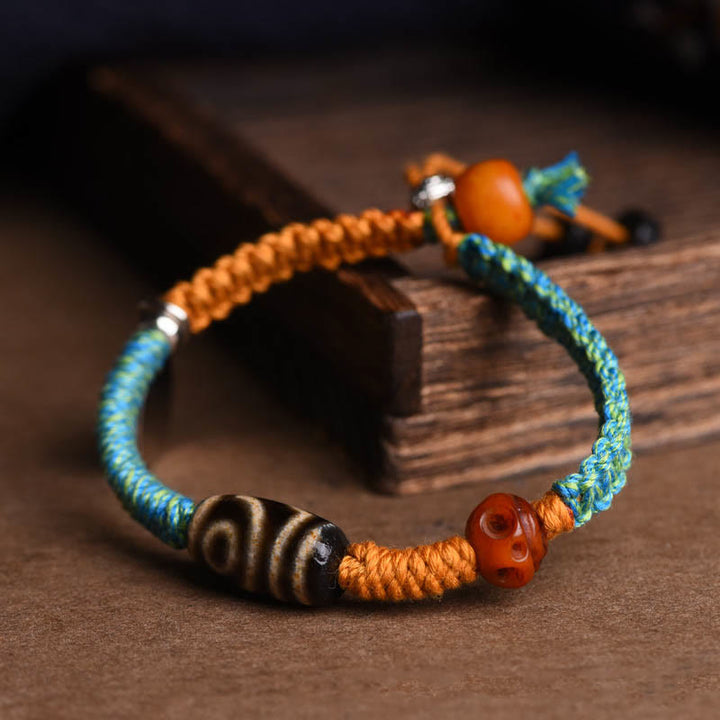 Bracciale intrecciato con perline Dzi tibetane fatte a mano di Buddha Stones