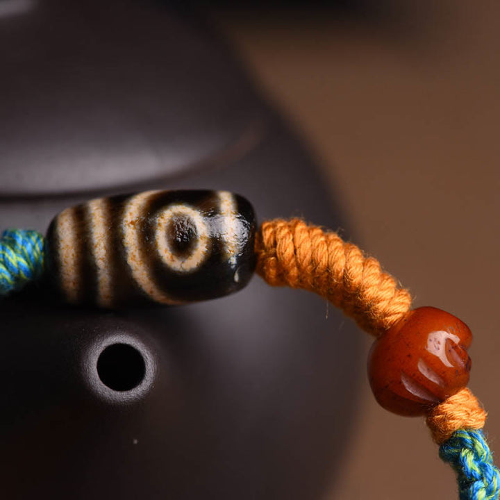 Bracciale intrecciato con perline Dzi tibetane fatte a mano di Buddha Stones