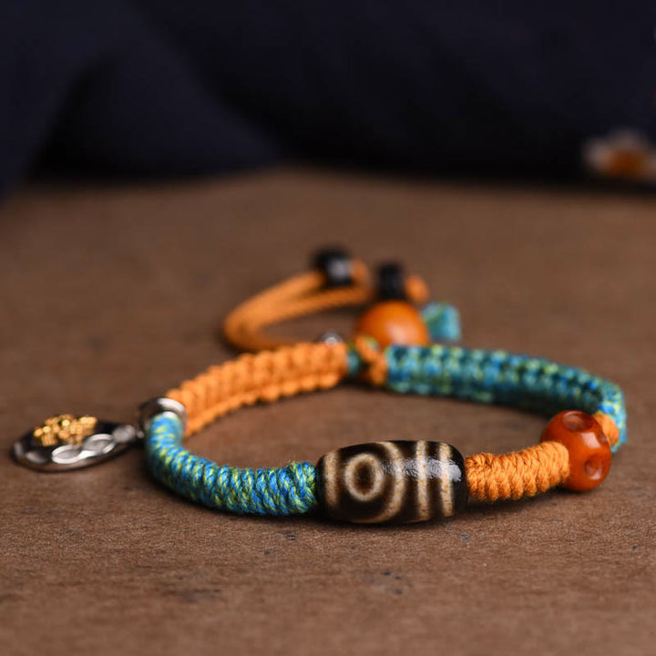 Bracciale intrecciato con perline Dzi tibetane fatte a mano di Buddha Stones