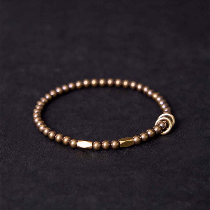 Braccialetto di coppia con perline in ottone e rame, design Buddha Stones Wealth Self Care - image 1