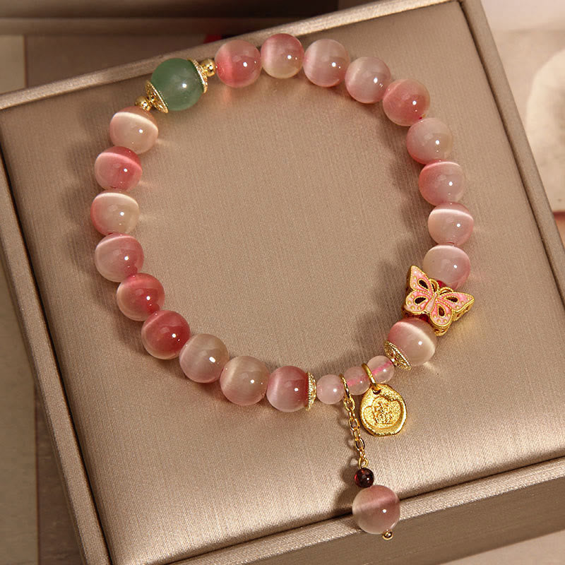 Braccialetto della pace con farfalla occhio di gatto rosa sfumato Buddha Stones