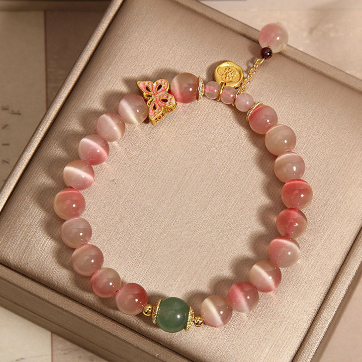 Braccialetto della pace con farfalla occhio di gatto rosa sfumato Buddha Stones