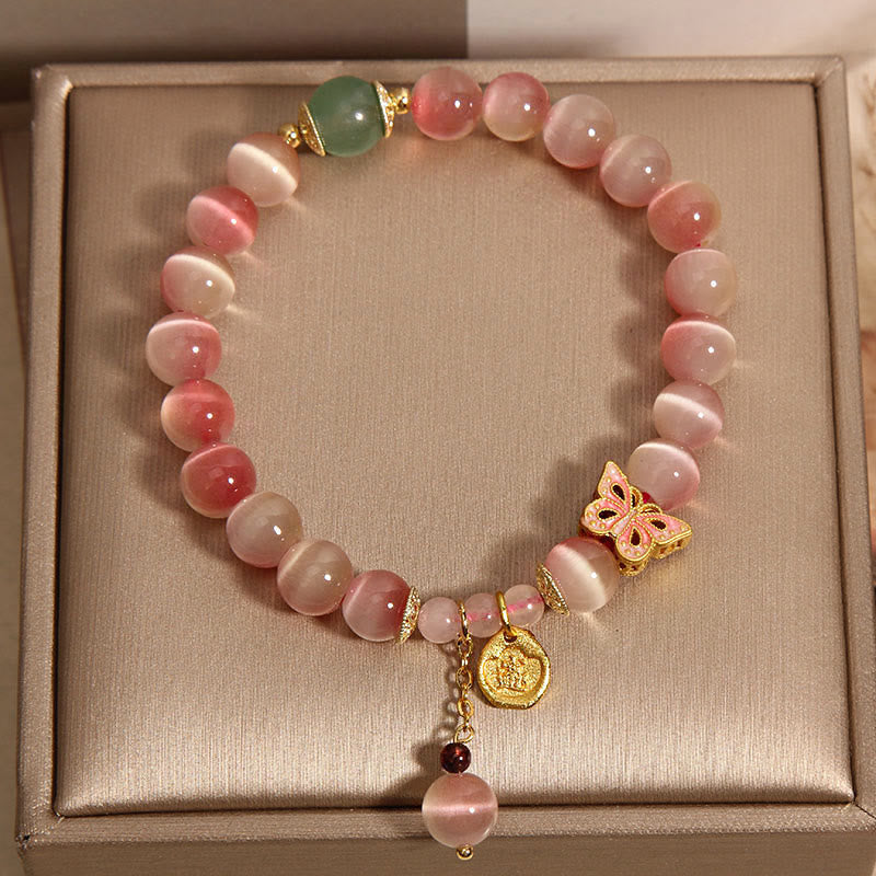 Braccialetto della pace con farfalla occhio di gatto rosa sfumato Buddha Stones