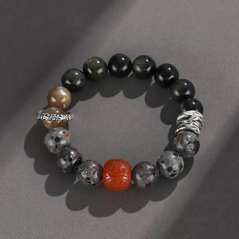 Braccialetto di protezione in agata rossa, ossidiana, pietra lavica e pietre dorate Buddha Stones