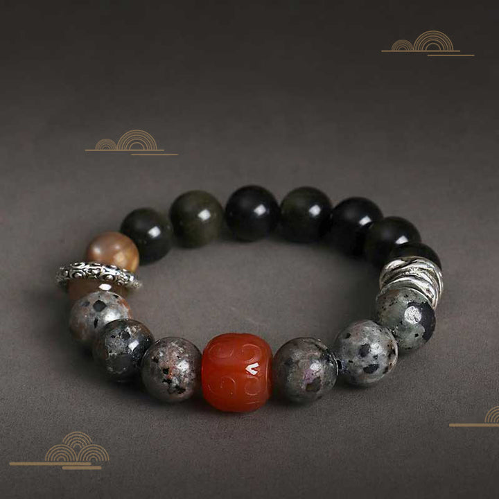 Braccialetto di protezione in agata rossa, ossidiana, pietra lavica e pietre dorate Buddha Stones