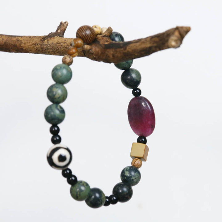 Braccialetto di successo di potere di perline Dzi a tre occhi in agata verde Buddha Stones