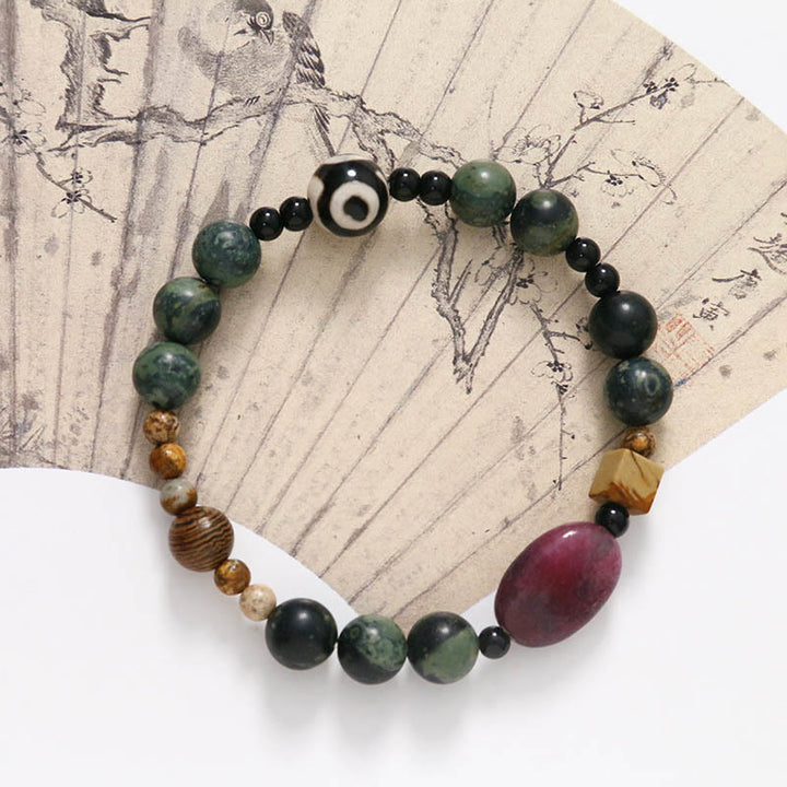 Braccialetto di successo di potere di perline Dzi a tre occhi in agata verde Buddha Stones