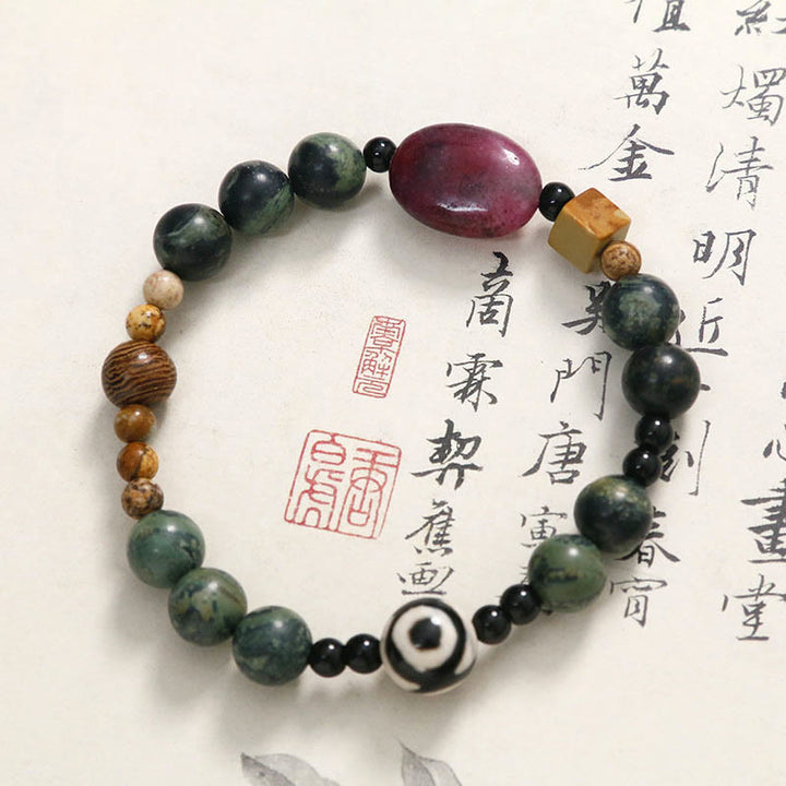 Braccialetto di successo di potere di perline Dzi a tre occhi in agata verde Buddha Stones