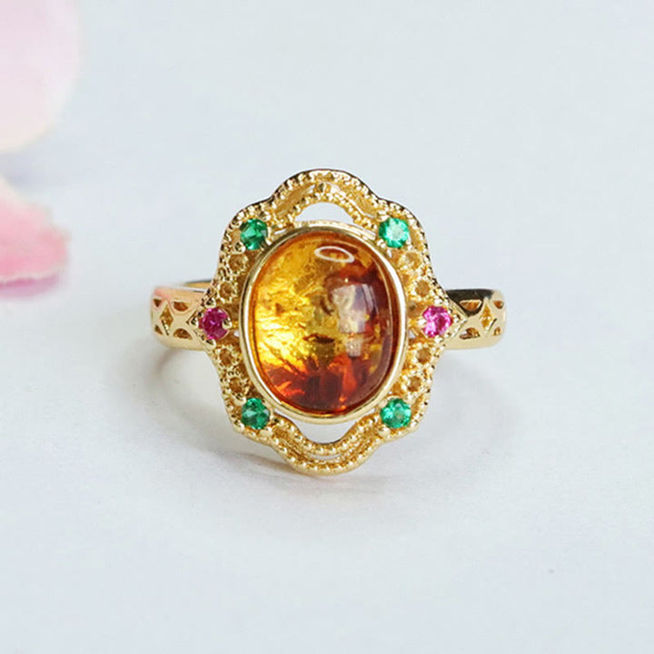 Anello di fiducia in Buddha Stones con fiore di ambra cava in pizzo