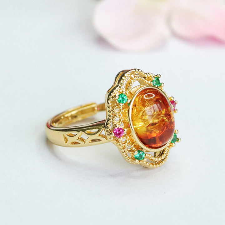 Anello di fiducia in Buddha Stones con fiore di ambra cava in pizzo