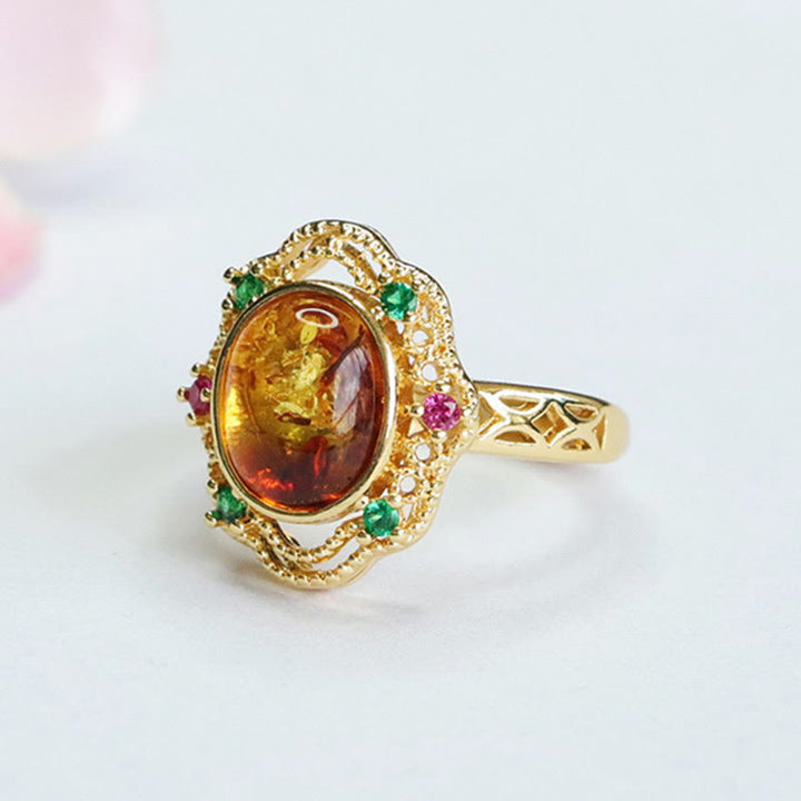 Anello di fiducia in Buddha Stones con fiore di ambra cava in pizzo