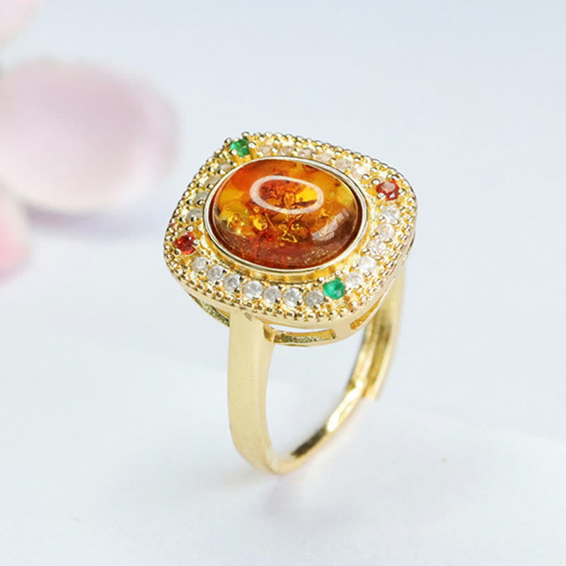 Anello di fiducia con supporto quadrato con fiore di ambra naturale Buddha Stones