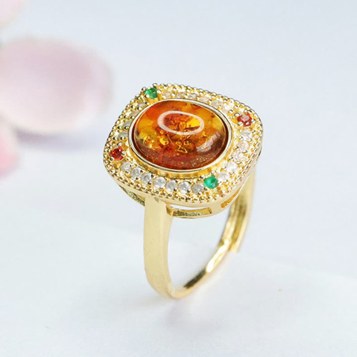 Anello di fiducia con supporto quadrato con fiore di ambra naturale Buddha Stones