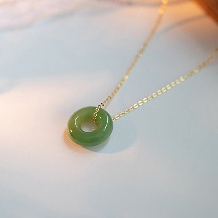 Collana con ciondolo con fibbia della pace in giada Hetian placcata in oro e argento sterling 925 Buddha Stones - image 1