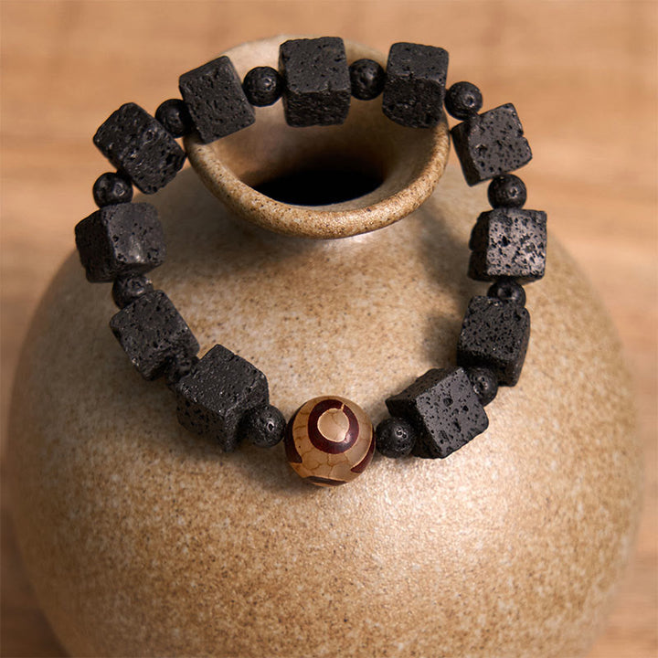 Braccialetto di guarigione con perline di Dzi e pietra lavica Buddha Stones