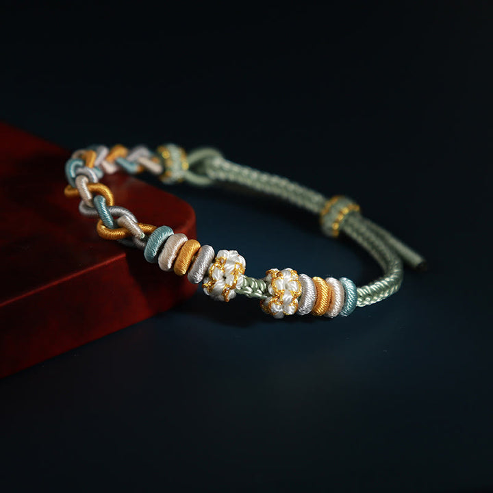 Braccialetto di collegamento Buddha Stones String Four Srand Peach Blossom