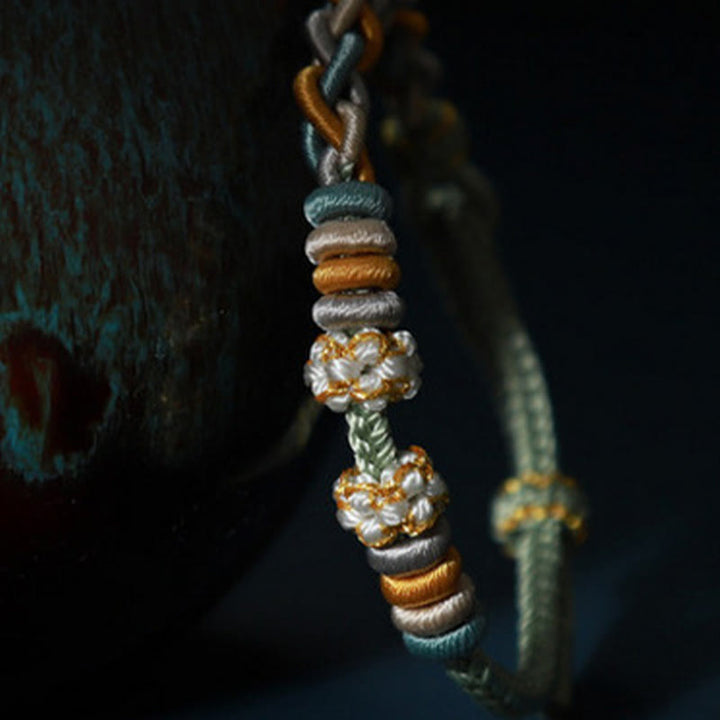 Braccialetto di collegamento Buddha Stones String Four Srand Peach Blossom