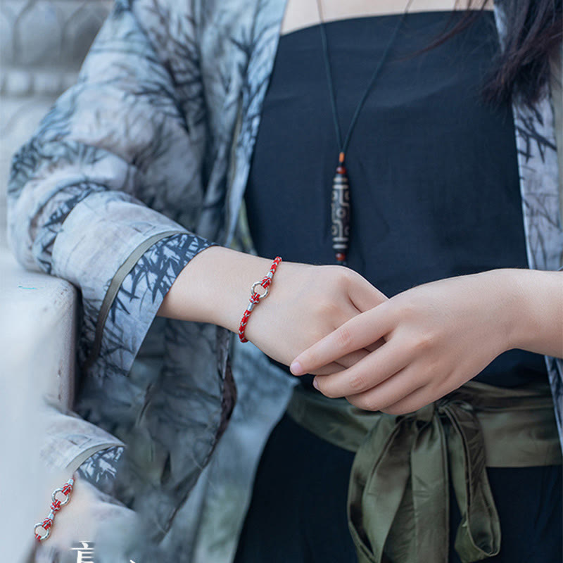 Bracciale portafortuna in argento sterling 925 con cordino rosso Buddha Stones