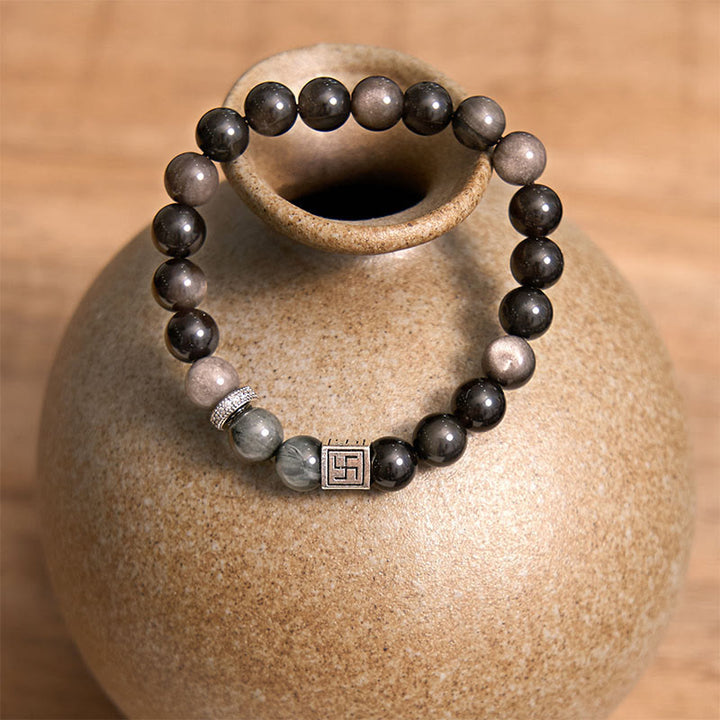 Braccialetto di forza e coraggio in ossidiana nera con occhio d'aquila di Buddha Stones