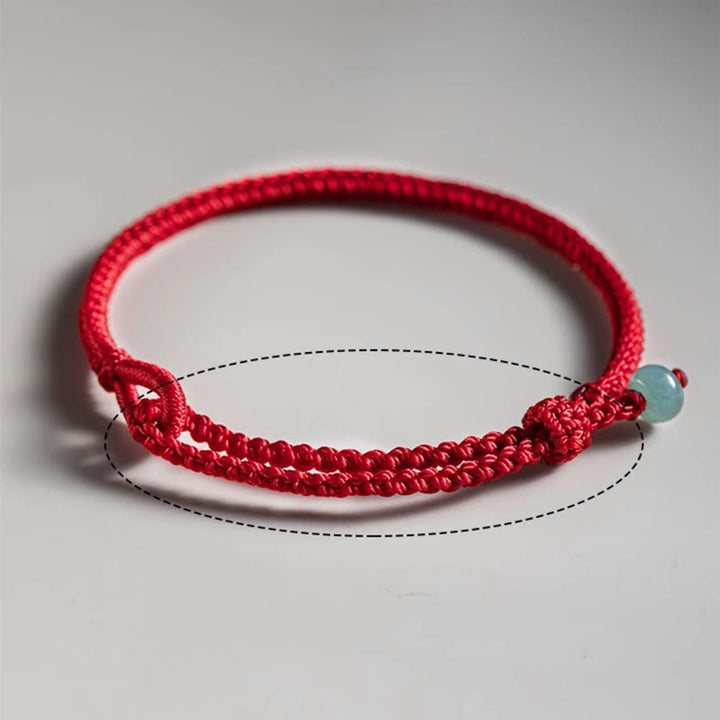Braccialetto di collegamento in giada con filo rosso Buddha Stones