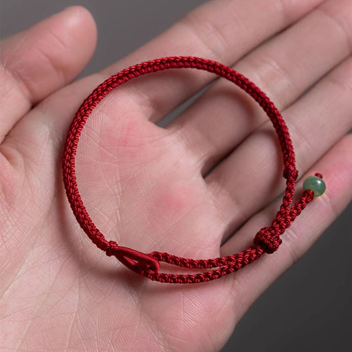 Braccialetto di collegamento in giada con filo rosso Buddha Stones