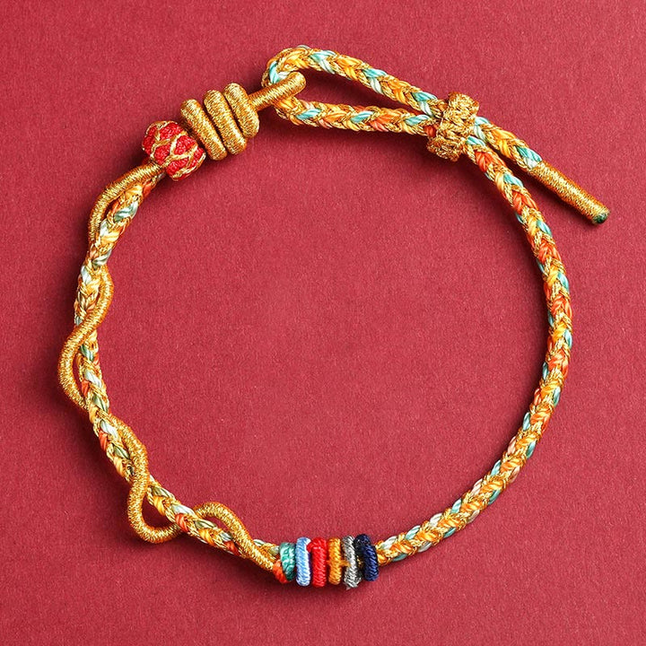 Braccialetto intrecciato di protezione dell'anno del serpente con corda rossa Buddha Stones
