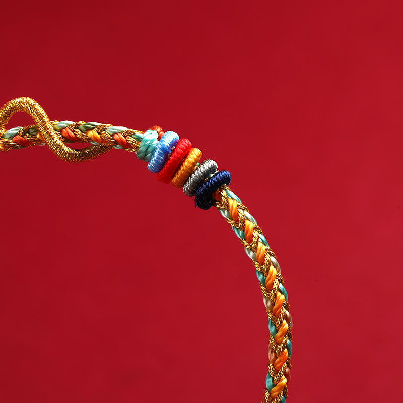 Braccialetto intrecciato di protezione dell'anno del serpente con corda rossa Buddha Stones