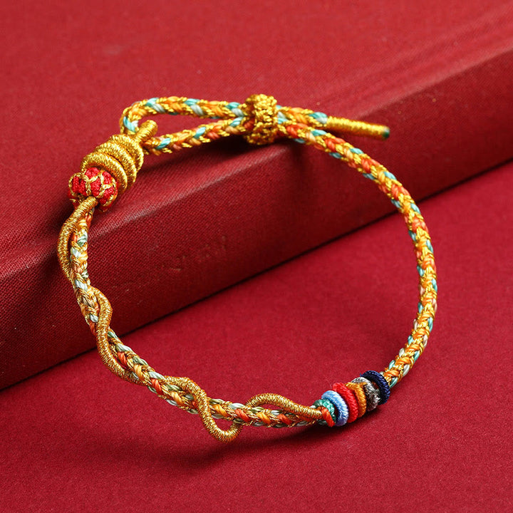 Braccialetto intrecciato di protezione dell'anno del serpente con corda rossa Buddha Stones